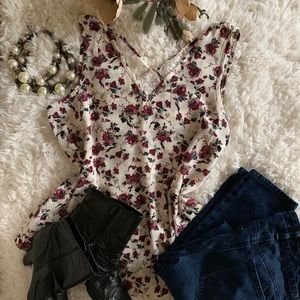 Maurice’s off-white tank with red floral top